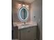 Bathroom with an illuminated oval mirror and vanity at 1942 S Emerson -- # 131, Mesa, AZ 85210