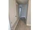 Clean hallway with tile floors and access to laundry at 1942 S Emerson -- # 131, Mesa, AZ 85210