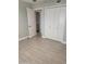 Bedroom with gray tile floors, white closet doors and bath access at 1942 S Emerson -- # 131, Mesa, AZ 85210