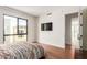Bright bedroom with large window, hardwood floors, and modern decor at 6311 E Phoenician Blvd # 18, Scottsdale, AZ 85251