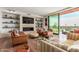 Open living space with fireplace, large windows, and hardwood floors at 6311 E Phoenician Blvd # 18, Scottsdale, AZ 85251