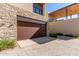 Attached two-car garage with modern wood door at 6311 E Phoenician Blvd # 18, Scottsdale, AZ 85251