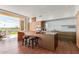 Contemporary kitchen with island, wood cabinetry, and patio access at 6311 E Phoenician Blvd # 18, Scottsdale, AZ 85251