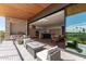Covered patio with seating area, fire pit, and views of the kitchen at 6311 E Phoenician Blvd # 18, Scottsdale, AZ 85251