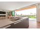 Kitchen island with sink and stunning views from sliding doors at 6311 E Phoenician Blvd # 18, Scottsdale, AZ 85251