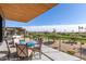 Spacious patio with seating area, offering stunning golf course views at 6311 E Phoenician Blvd # 18, Scottsdale, AZ 85251