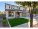 Two-story house with artificial turf and a two-car garage at 3535 E Melody Ln, Gilbert, AZ 85234