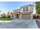 Two-story home with a large driveway and landscaped lawn at 3535 E Melody Ln, Gilbert, AZ 85234