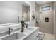 Modern bathroom with double vanity and walk-in shower at 9520 S Krista W Dr, Goodyear, AZ 85338