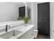 Modern bathroom with a sleek double vanity and marble countertop at 9520 S Krista W Dr, Goodyear, AZ 85338