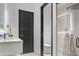 Modern bathroom with frameless glass shower at 9520 S Krista W Dr, Goodyear, AZ 85338