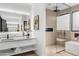 Modern bathroom with a large walk-in shower and double vanity at 9520 S Krista W Dr, Goodyear, AZ 85338