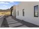 Modern home exterior with a walkway leading to the front entrance at 9520 S Krista W Dr, Goodyear, AZ 85338