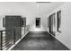 Modern hallway with dark flooring and balcony access at 9520 S Krista W Dr, Goodyear, AZ 85338