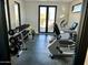 Well-equipped home gym with mountain views at 9520 S Krista W Dr, Goodyear, AZ 85338
