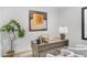 Bright home office with a desk and two chairs at 9520 S Krista W Dr, Goodyear, AZ 85338