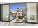 Sliding glass doors open to a luxurious backyard at 9520 S Krista W Dr, Goodyear, AZ 85338