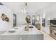 Gourmet kitchen boasting a spacious island and marble countertops at 9520 S Krista W Dr, Goodyear, AZ 85338
