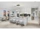 Modern kitchen with a large island, white cabinetry, and high-end appliances at 9520 S Krista W Dr, Goodyear, AZ 85338