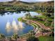 Scenic lakefront park with walking paths and fountains at 9520 S Krista W Dr, Goodyear, AZ 85338