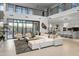 Spacious living area featuring a large sectional sofa and high ceilings at 9520 S Krista W Dr, Goodyear, AZ 85338