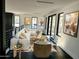 Bright living room with modern furniture and access to a deck at 9520 S Krista W Dr, Goodyear, AZ 85338