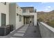 Stone patio with seating area and mountain views at 9520 S Krista W Dr, Goodyear, AZ 85338