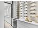 Temperature-controlled wine cellar with extensive shelving at 9520 S Krista W Dr, Goodyear, AZ 85338