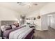 Bedroom with built-in workspace and ensuite bathroom at 30118 N Maravilla Dr, San Tan Valley, AZ 85143