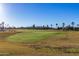 Landscaped golf course with palm trees and lush greens at 4675 N Bryce Canyon Ct, Eloy, AZ 85131