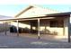 Covered patio with tile flooring and adjacent to the house at 1545 W Vaughn Ave, Gilbert, AZ 85233