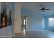 Living room with an open floor plan, high ceilings, and light blue walls at 1545 W Vaughn Ave, Gilbert, AZ 85233