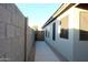 Side yard with a walkway and access gate at 1545 W Vaughn Ave, Gilbert, AZ 85233