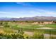 Scenic view of a golf course with mountain background at 28602 N Summit Springs Rd, Rio Verde, AZ 85263