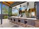 Outdoor bar with TV and seating for residents at 28602 N Summit Springs Rd, Rio Verde, AZ 85263