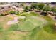 Aerial view of a golf course green with sand traps at 6364 E Star Valley Cir, Mesa, AZ 85215