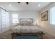 Large main bedroom with a king-size bed and barn door at 41728 W Sagebrush Ct, Maricopa, AZ 85138