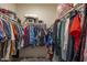 Large walk-in closet with plenty of shelving and hanging space at 41728 W Sagebrush Ct, Maricopa, AZ 85138