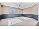 Bright bedroom with ceiling fan and large windows at 9237 W Alex Ave, Peoria, AZ 85382