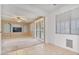 Bright and airy living room with tile flooring and access to backyard at 9237 W Alex Ave, Peoria, AZ 85382