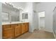 Double vanity bathroom with large mirror and walk-in shower at 10169 E Dinosaur Ridge Rd, Gold Canyon, AZ 85118