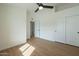 Spacious bedroom with wood floors, double-door closet and access to bathroom at 1436 E Charleston Ave, Phoenix, AZ 85022