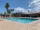 Community pool with lounge chairs and surrounding patio at 249 Beryl Dr, Apache Junction, AZ 85119