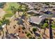 Single-story home with a large backyard, covered patio, and fire pit at 3507 N Snead Dr, Goodyear, AZ 85395