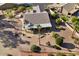 Single-story home with a covered patio, fire pit, and mature landscaping at 3507 N Snead Dr, Goodyear, AZ 85395