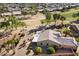 Single-story home with a large backyard, covered patio, and golf course view at 3507 N Snead Dr, Goodyear, AZ 85395