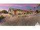 Relaxing backyard oasis with covered patio and pebble landscaping at 3507 N Snead Dr, Goodyear, AZ 85395