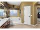 Large bathroom with a soaking tub and a separate shower at 3507 N Snead Dr, Goodyear, AZ 85395