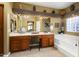 Elegant Primary bathroom featuring double vanities and a soaking tub at 3507 N Snead Dr, Goodyear, AZ 85395