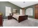 Well-lit bedroom with a comfortable bed and built-in storage at 3507 N Snead Dr, Goodyear, AZ 85395